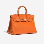 Pre-owned Hermès bag Birkin 35 Swift Orange H Orange Side Front | Sell your designer bag on Saclab.com