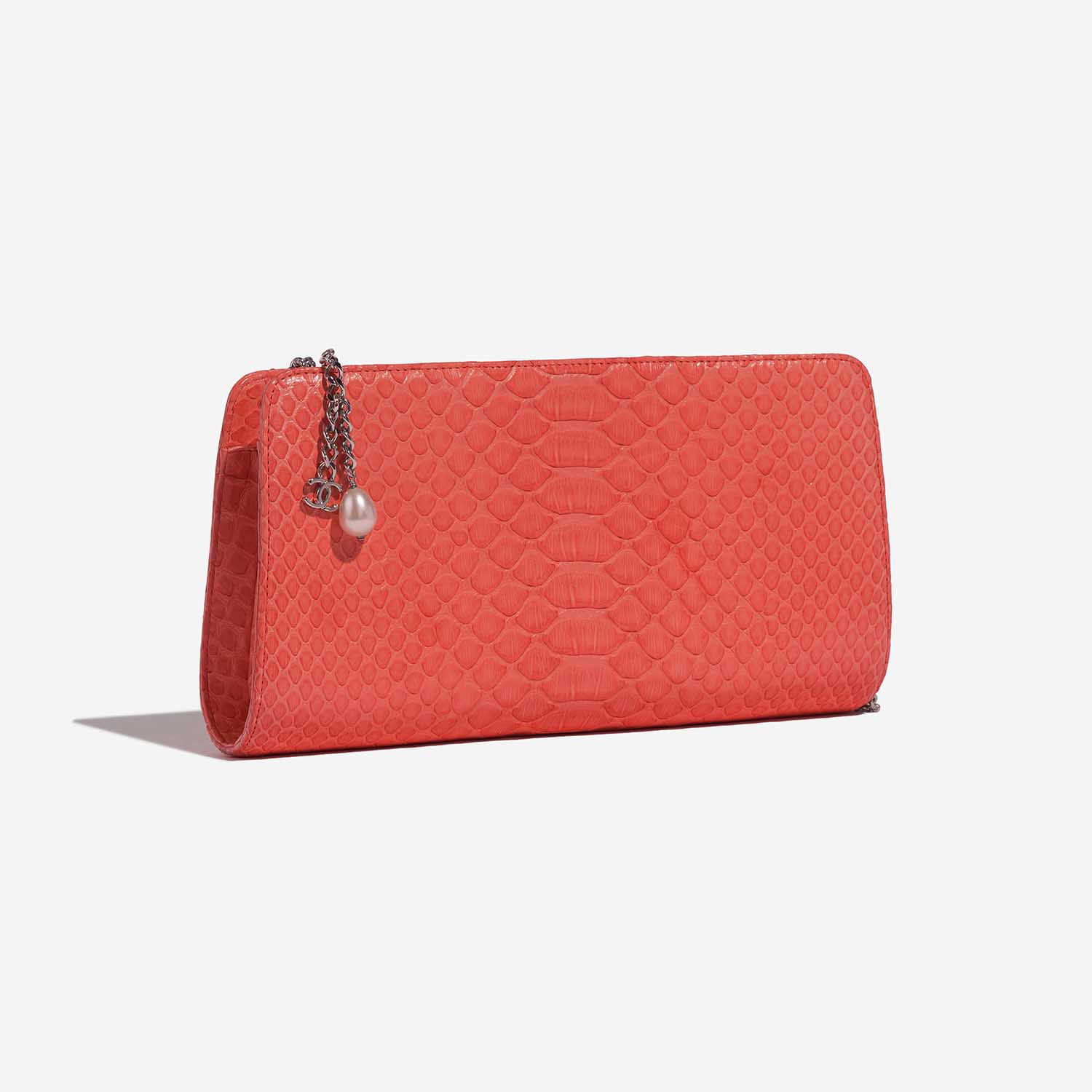 Pre-owned Chanel bag Clutch Python Coral Orange, Red Side Front | Sell your designer bag on Saclab.com