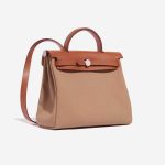 Pre-owned Hermès bag Herbag 31 Vache Hunter / Toile Militaire Fauve / Chai Beige, Brown Side Front | Sell your designer bag on Saclab.com