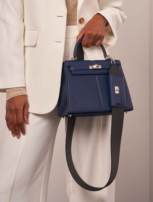 Hermès KellyPocketStrap Caban-BleuSaphir Sizes Worn | Sell your designer bag on Saclab.com