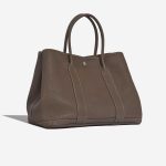 Pre-owned Hermès bag Garden Party 36 Negonda Etoupe Brown, Grey Side Front | Sell your designer bag on Saclab.com