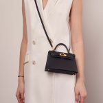 Hermès Kelly Mini BlueIndigo Sizes Worn | Sell your designer bag on Saclab.com