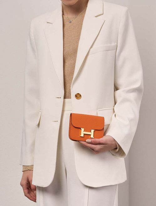 Hermès Constance SlimWallet OrangeH Sizes Worn | Sell your designer bag on Saclab.com