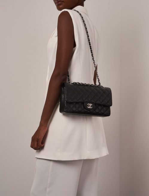 Chanel Timeless Medium Black on Model | Sell your designer bag on Saclab.com