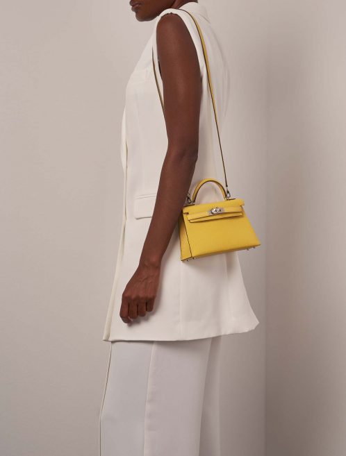 Hermès Kelly Mini JauneAmbre-Orange on Model | Sell your designer bag on Saclab.com