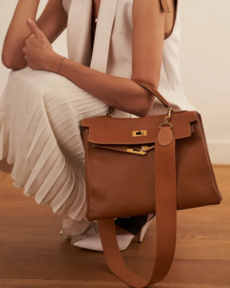 A Brown Kelly with a wide strap, sold on saclab.com
