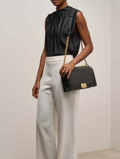 Chanel Boy NewMedium Black on Model | Sell your designer bag on Saclab.com
