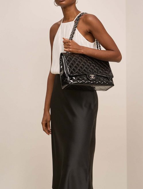 Chanel Timeless Maxi Black on Model | Sell your designer bag on Saclab.com