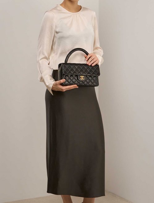Chanel TimelessHandle Medium Black on Model | Sell your designer bag on Saclab.com