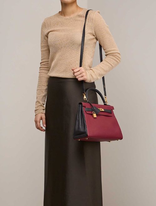 Hermès Kelly HSS 28 Togo Rubis / Black  on Model | Sell your designer bag