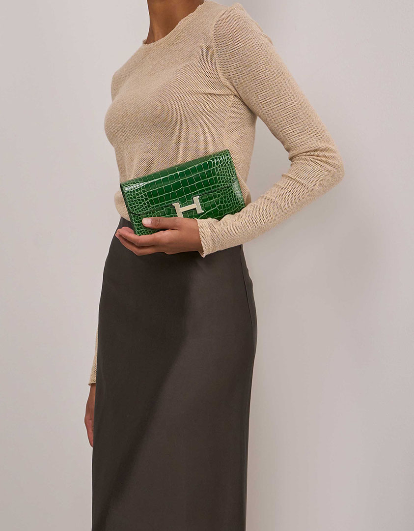 Hermès Constance Long Wallet Alligator Mississippi Vert Cactus on Model | Sell your designer bag