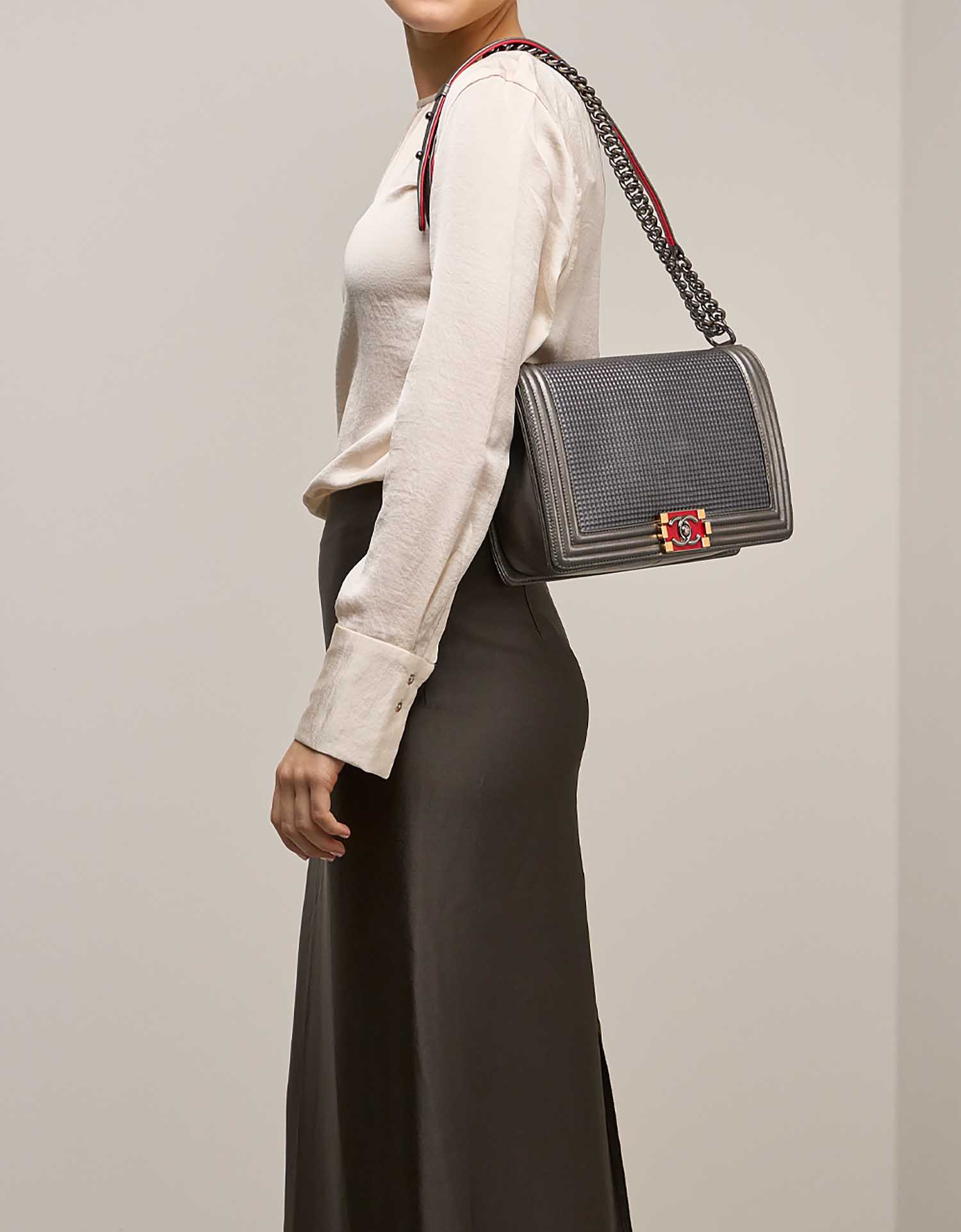 Chanel Boy New Medium Lamb Metallic Grey / Red on Model | Sell your designer bag