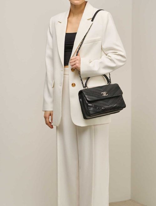 Chanel Trendy CC Medium Lamb / Python / Coated Fabric Black on Model | Sell your designer bag