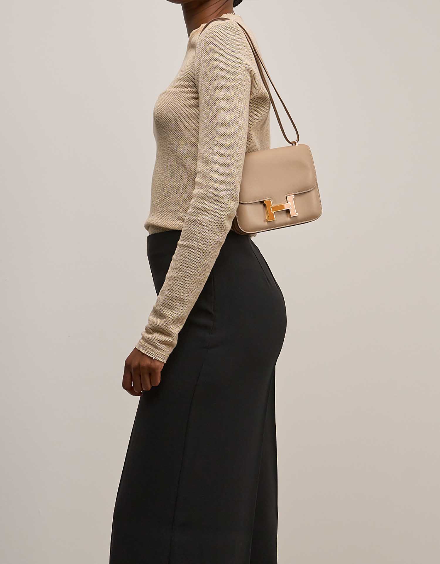 Hermès Constance 18 Swift Biscuit / Moutarde on Model | Sell your designer bag