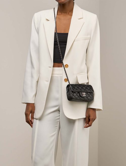 Chanel Timeless Extra Mini Lamb Black on Model | Sell your designer bag