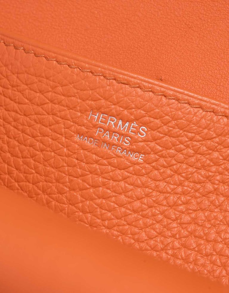 Hermès Halzan 25 Taurillon Clémence Orange Minium Logo | Sell your designer bag