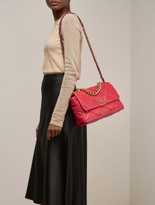 Chanel 19 Large Flap Bag Lamb Coral Red on Model | Sell your designer bag