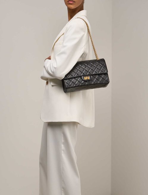 Chanel 2.55 Reissue 226 Aged Calf Black on Model | Sell your designer bag