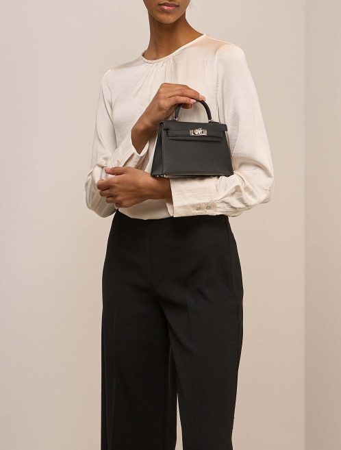 Hermès Kelly Mini Epsom Black on Model | Sell your designer bag