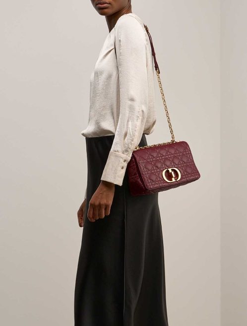 Dior Caro Medium Calf Dark Red on Model | Sell your designer bag