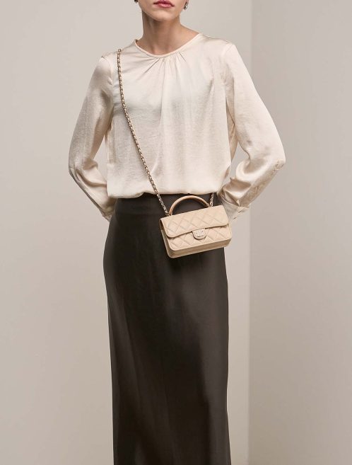 Chanel Timeless Wallet On Chain Lamb Beige on Model | Sell your designer bag