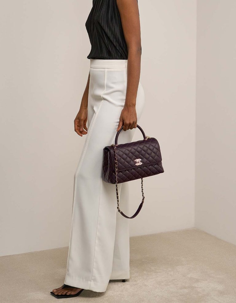 Chanel Timeless Handle Medium Caviar Dark Plum on Model | Sell your designer bag
