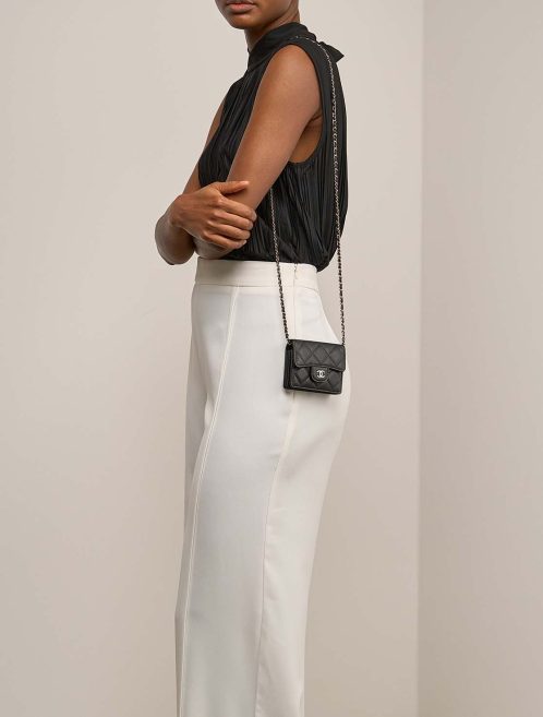 Chanel Timeless Extra Mini Caviar Black on Model | Sell your designer bag