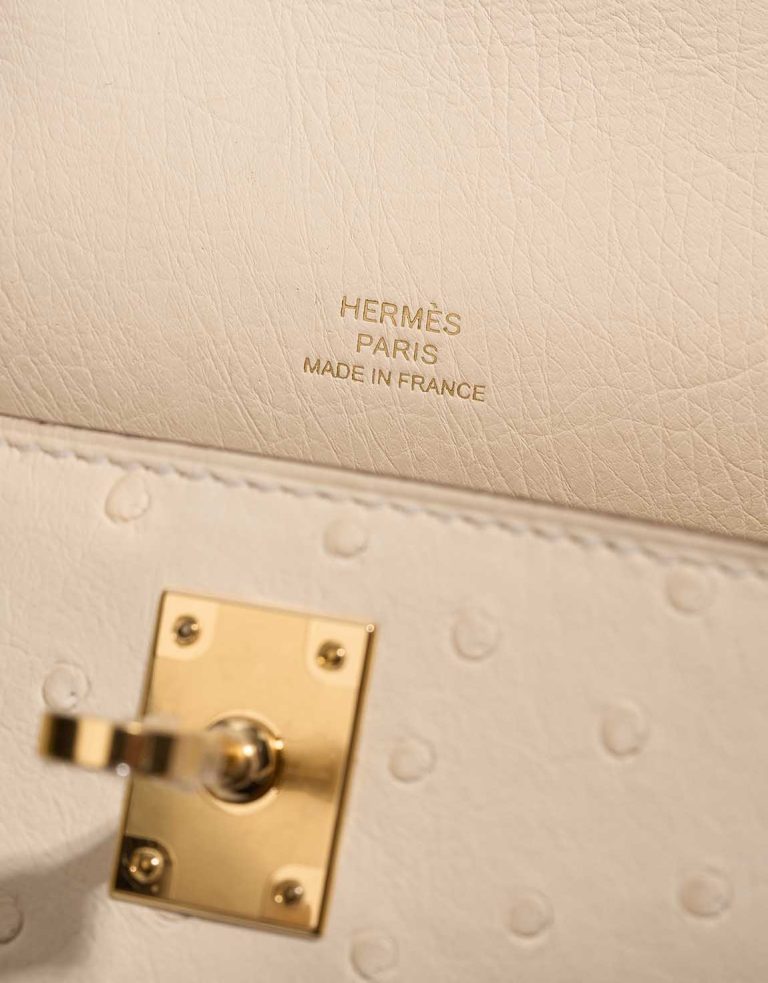 Hermès Kelly Pochette Mini Ostrich Nata Logo | Sell your designer bag