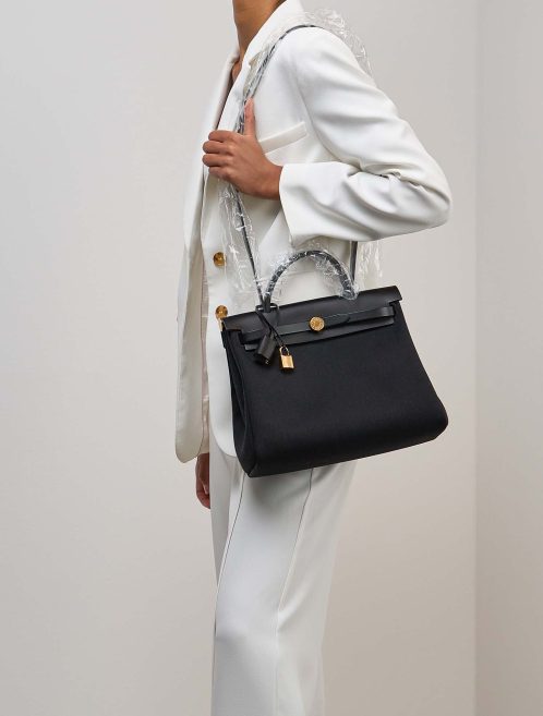 Hermès Herbag 31 Toile / Vache Hunter Black on Model | Sell your designer bag