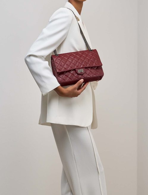 Chanel 2.55 Reissue 227 Aged Calf Burgundy on Model | Sell your designer bag