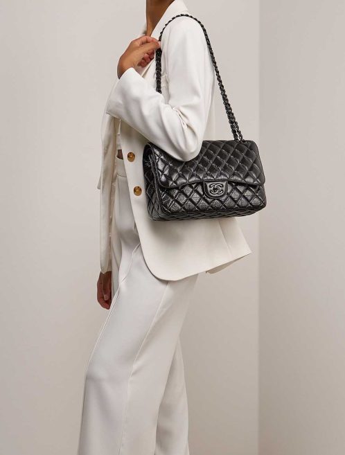 Chanel Timeless Jumbo Patent So Black on Model | Sell your designer bag