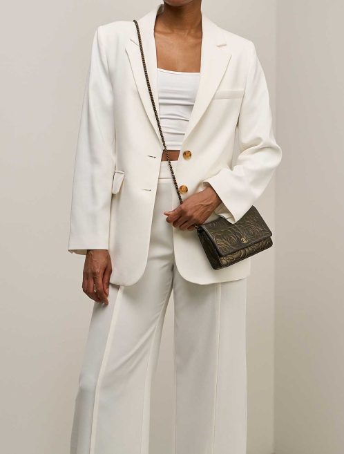 Chanel Wallet On Chain Camellia Calf Black / Gold on Model | Sell your designer bag