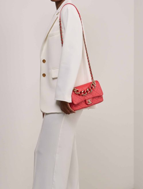 Chanel Timeless Flap Bag Medium Lamb Coral Red on Model | Sell your designer bag