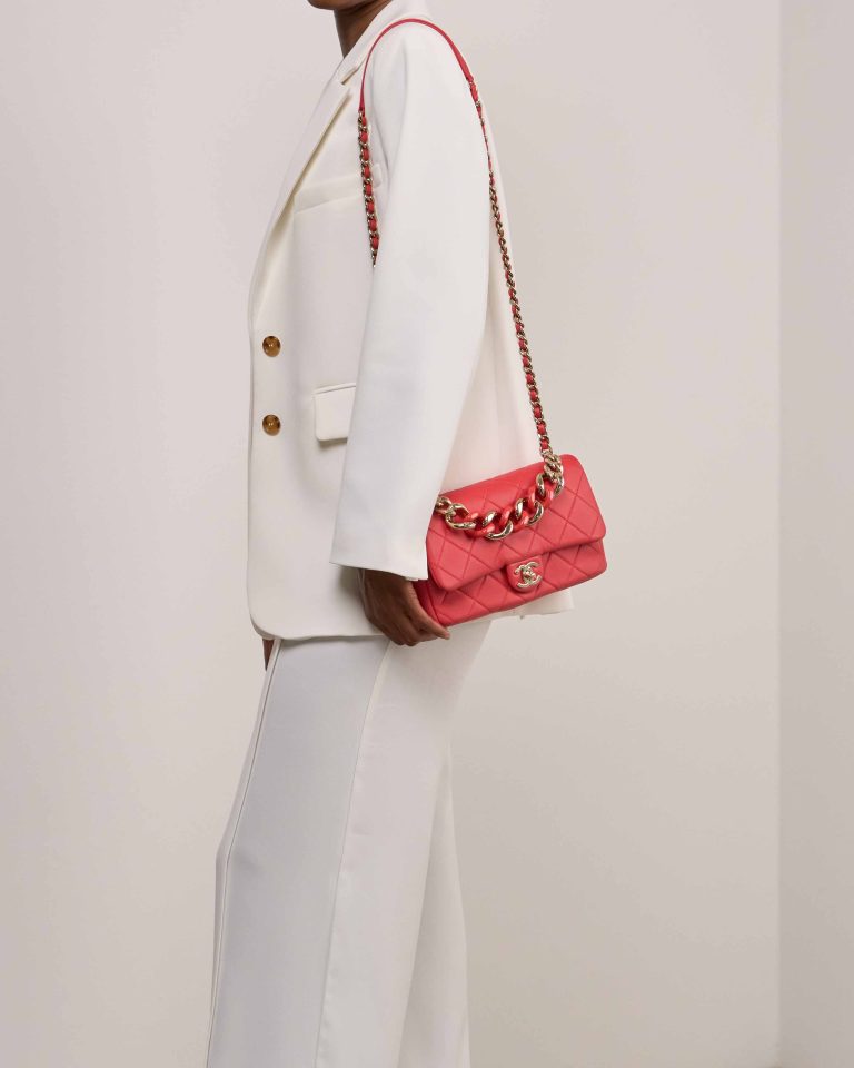 Chanel Timeless Flap Bag Medium Lamb Coral Red on Model | Sell your designer bag