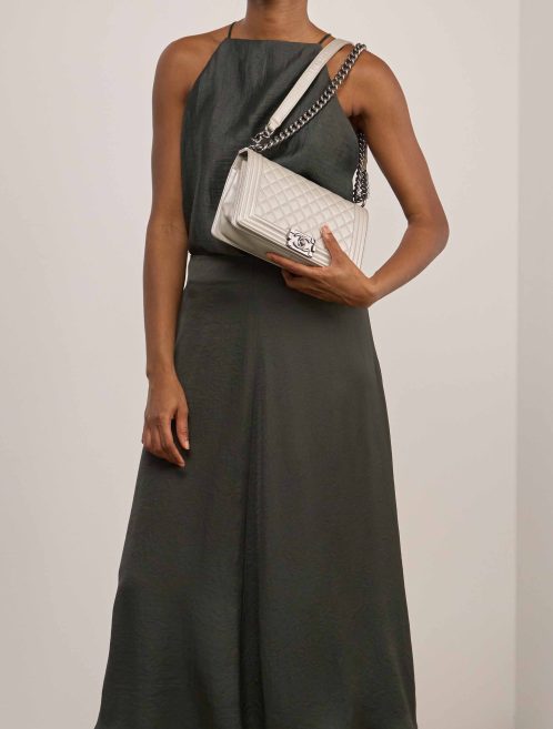 Chanel Boy Old Medium Caviar Silver on Model | Sell your designer bag