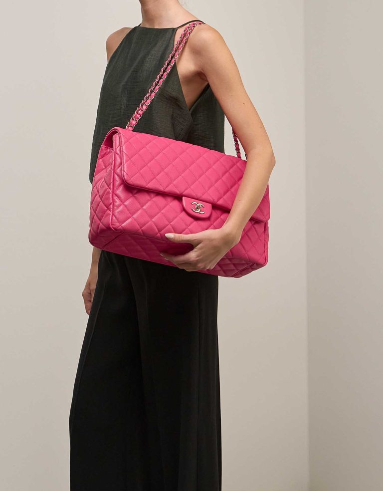 Chanel Flap Bag XXL Caviar Hot Pink on Model | Sell your designer bag