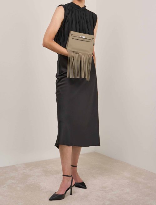 Hermès Kelly Danse Anate Swift Beige Marfa on Model | Sell your designer bag