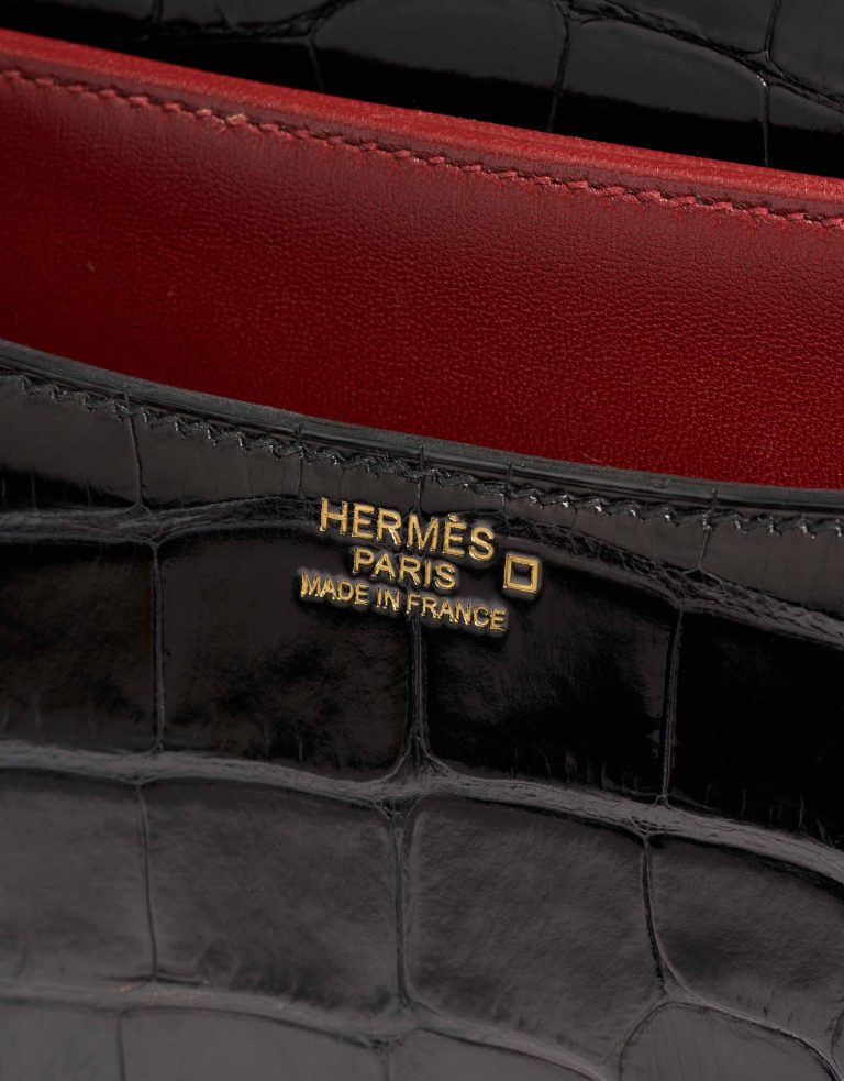 Hermès Constance 24 Alligator Mississippi Noir / Rouge Grenat Logo | Vendre votre sac de créateur