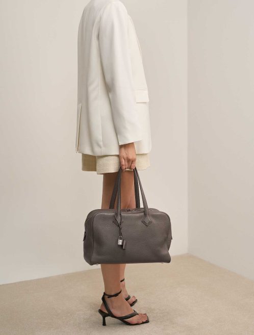 Hermès Victoria 35 Clémence Étoupe on Model | Sell your designer bag