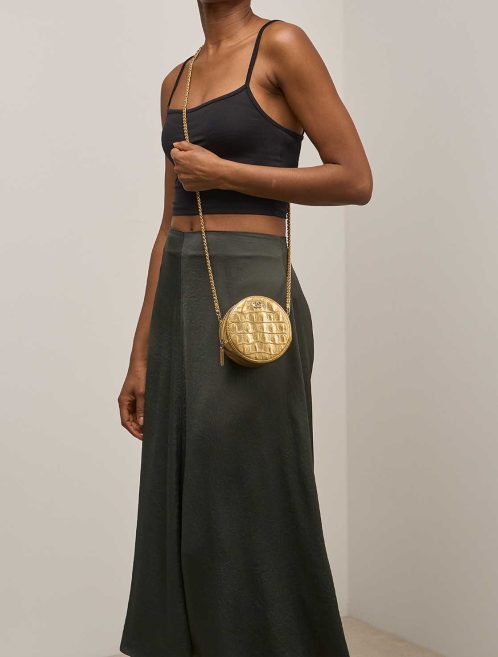 Chanel Round Clutch Calf Gold on Model | Sell your designer bag