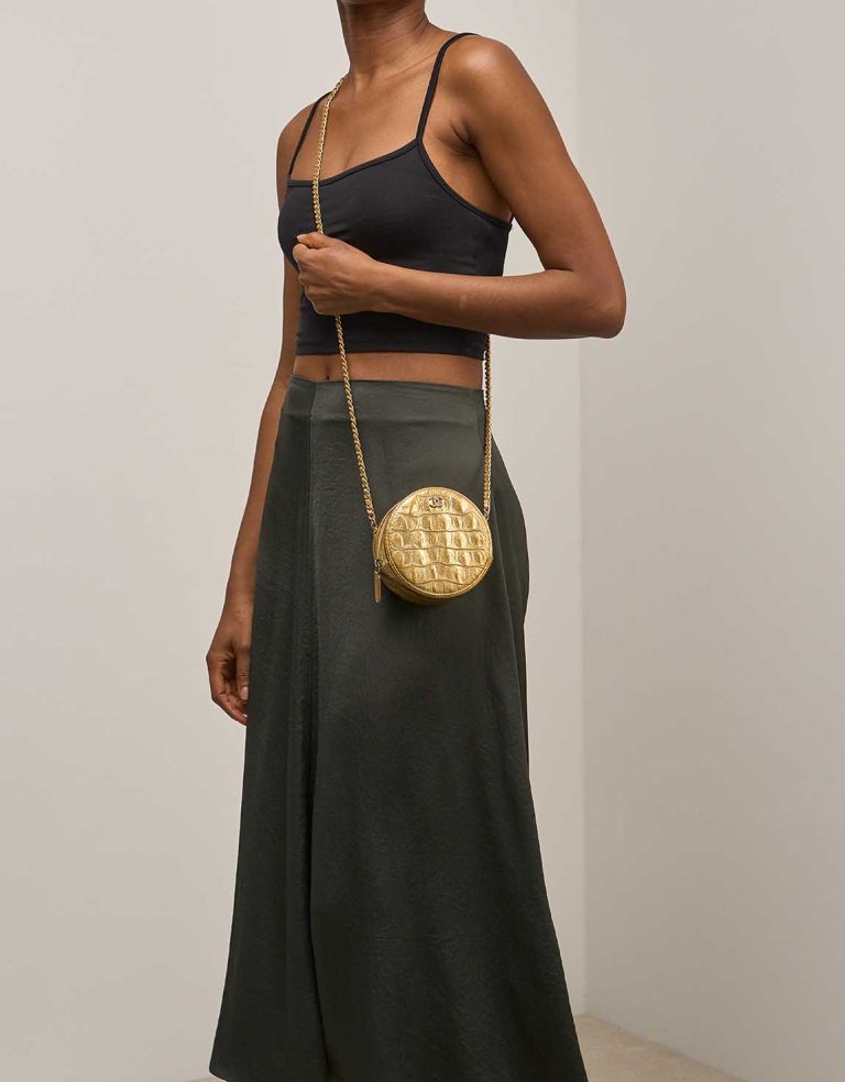 Chanel Round Clutch Calf Gold on Model | Sell your designer bag