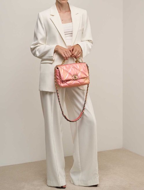 Chanel 19 Flap Bag Lamb Iridescent Pink on Model | Sell your designer bag