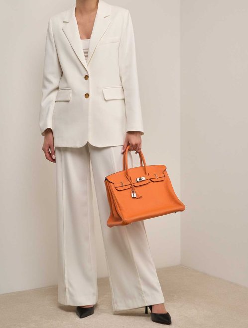 Hermès Birkin 35 Orange Clémence on Model | Sell your designer bag