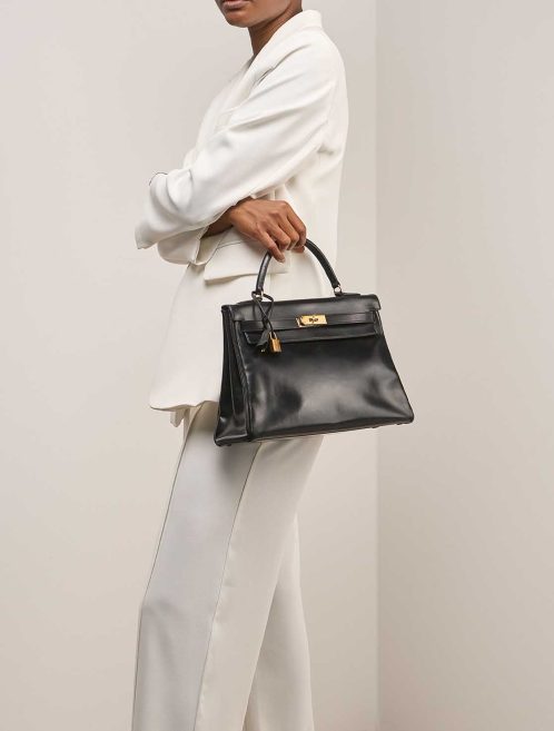 Hermès Kelly 32 Box Black on Model | Sell your designer bag