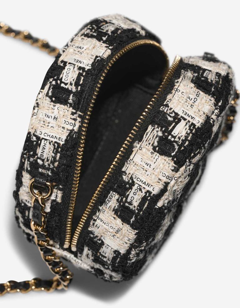 Chanel Round Clutch Tweed Black / White Inside | Sell your designer bag