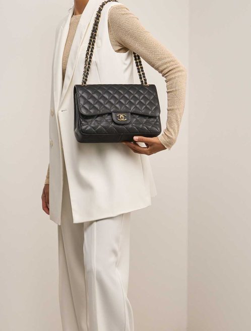 Chanel Timeless Jumbo Caviar Black on Model | Sell your designer bag