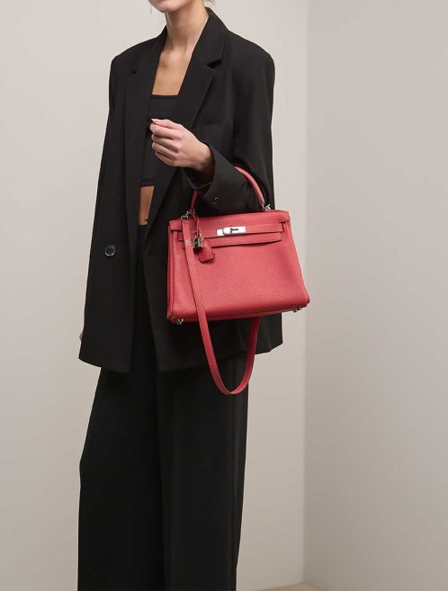 Hermès Kelly 28 Togo Rouge Pivoine on Model | Sell your designer bag