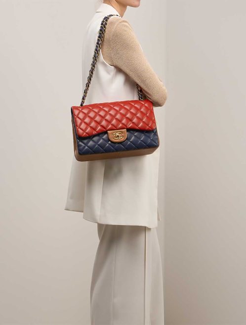 Chanel Timeless Jumbo Lamb Blue / Red / Brown on Model | Sell your designer bag