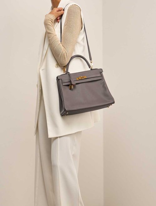 Hermès Kelly HSS 32 Swift Gris Meyer / Rouge Grenat on Model | Sell your designer bag