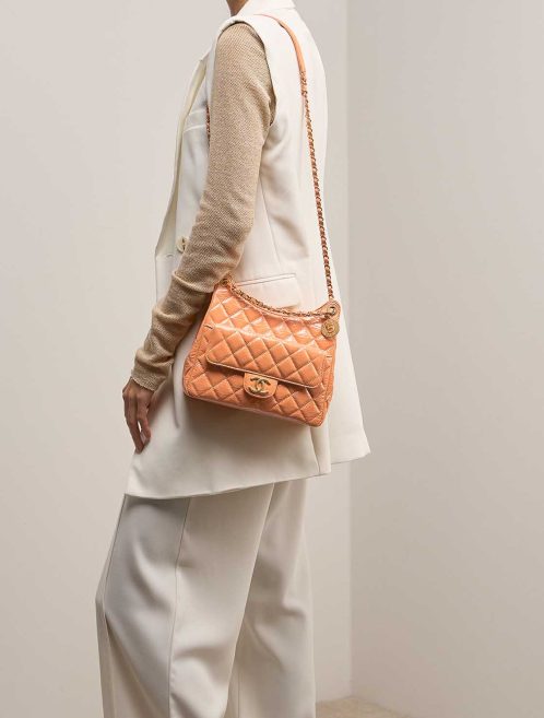 Chanel Hobo Aged Calf Orange on Model | Sell your designer bag